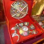 A collection of Oriental items including a boxed miniature tea set, chopsticks and fans
