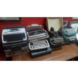 A collection of vintage typewriters including Oliver Typewriter Company Ltd of London