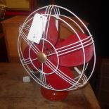 A c1930's Revo Upper Thames industrial fan painted red with bakelite blades