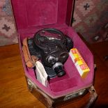 A C1940's Bell & Howell Company American 16 mm camera in a fitted leather case