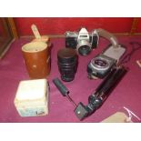 An interesting collection of photographic equipment including Praktica IV 35 mm camera and other