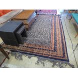 A Persian style carpet with lattice design on blue border within multi border