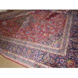 A fine central Persian Kashan carpet, the central pendant medallion on a rouge field with