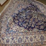 An extremely fine central Persian part silk Nain carpet central pendant medallion on sapphire