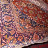 An extremely fine central Persian Kashan rug, having a pendant medallion surrounded by palmettes and