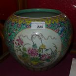 A Chinese porcelain jardiniere decorated with still life reserves