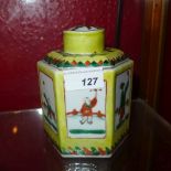 A Chinese porcelain hexagonal tea caddy hand painted with figures in pictorial reserves on a