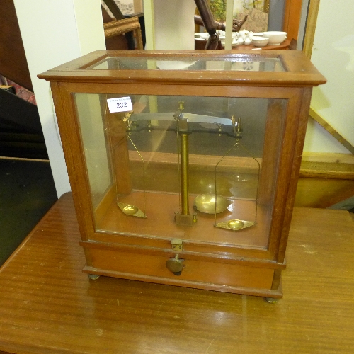 A cased set of weighing scales