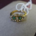 A 18ct diamond and emerald ring