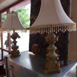 A pair of crackle glazed and gilded table lamps with shades