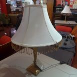 A pair of gilded spiral column table lamps with shades