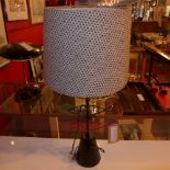 A 1960's American modernist table lamp in the form of three fish with mottled fabric shade