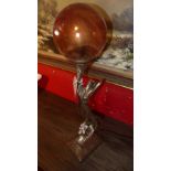 An Art Deco style table lamp with frosted glass shade in the form of a maiden