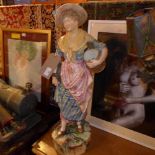 A C19th German ceramic figure of a milkmaid