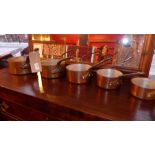 A set of five French vintage copper saucepans of graduating size