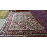 A fine North West Persian Malayer rug 260cm x 128 cm repeating heratie motifs on a camel field