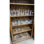 A large collection of cut glass to include champagne and wine glasses, bowl, lidded box,