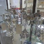 A silver stem vase (Af) and a collection of silver plated vases and a candlestick