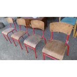 A set of four wooden mounted red enamel stacking chairs