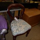 A pair of Victorian design mahogany balloon back side chairs with stuff over seats on turned