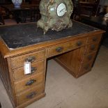 An Edwardian oak pedestal desk,