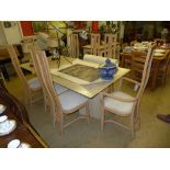 A faux marble dining suite viz a faux marble rectangular table and a set of eight beech dining