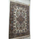 A large handwoven Persian pure silk the ivory field with central indigo and brown floral medallion