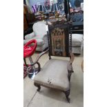 A Victorian rosewood open armchair the pad back with spindle above stuff over seat on cabriole