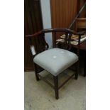 A Chippendale design mahogany corner chair with pierced splat back above stuff over seat on