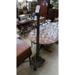 An early C20th wrought iron standard lamp