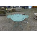 A wrought iron green painted patio set table and two chairs