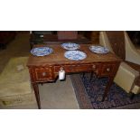 An Edwardian inlaid mahogany writing table with three fringe drawers on square tapering supports 
H