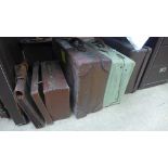 Two bygone leather suitcases