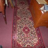 An extremely fine North West Persian Sarouk runner, 270cm x 85cm, repeating floral pole medallion on