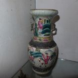 A near pair of Chinese famille rose twin handled vases decorated with figures,