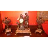 A C19th French spelter and marble clock garniture with a young lady and cherub figural surmount