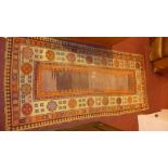 A hand knotted Persian runner the beige ground with stylised motifs