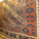 A hand knotted Persian Belouch rug the blue ground with stylised motifs