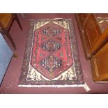 A Persian hand knotted rug the rouge fie