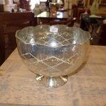 A pair of silvered glass pedestal bowls