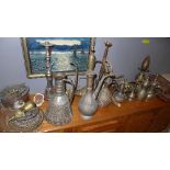 A collection of eight Islamic vessels including a rose sprinkler and coffee pots