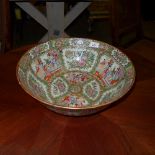 A Chinese Famile Rose punch bowl with alternating figural and foliate reserves (AF) and an oak