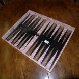 A black and pink marble backgammon board