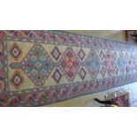 A hand knotted Caucasian runner the cream fields with geometric decoration