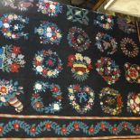 A fine Aubusson needlepoint carpet the black ground with polychrome floral motifs enclosed by