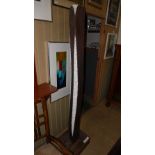 WITHDRAWN
A contemporary carved wooden sculpture of carved and elongated form having chip carved