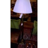 SOLD IN TIMED AUCTION A brass Corinthian column standard lamp