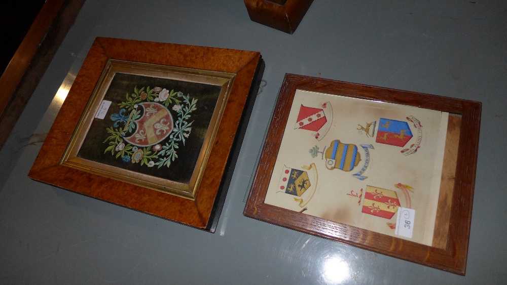 A C19th hand painted Hippesley family armorial crest in a burr frame,