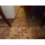 A large hand knotted Agra type carpet the green ground with floral stylised decoration