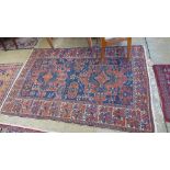 An antique Caucasian rug and two large bellouch rugs